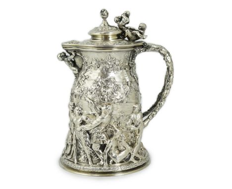 ROYAL INTEREST: A good ornate Victorian Teniers style silver ewer with hinged cover by Frederick Elkington, embossed in relie