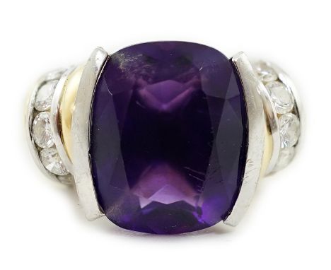 A modern 18ct gold and single stone cushion cut amethyst set dress ring, with ten stone round brilliant cut diamond set shoul