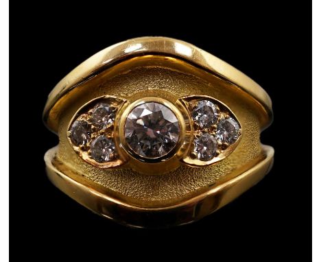 A 1990's part textured 18ct gold and collet set single stone diamond ring by Leo De Vroomen, with six stone diamond set shoul