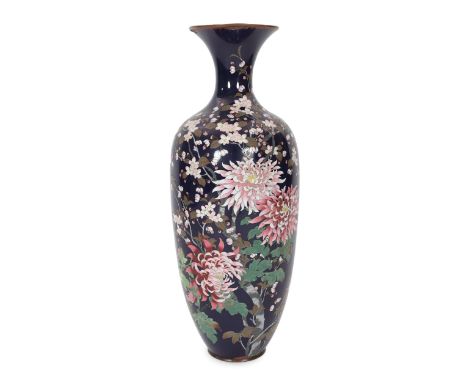 A massive Japanese midnight blue ground cloisonné enamel vase, Meiji period, decorated with chrysanthemums and prunus on a mi