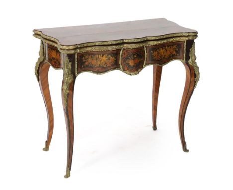 A late 19th century French ormolu mounted marquetry card table with serpentine folding top opening to reveal a circular pale 