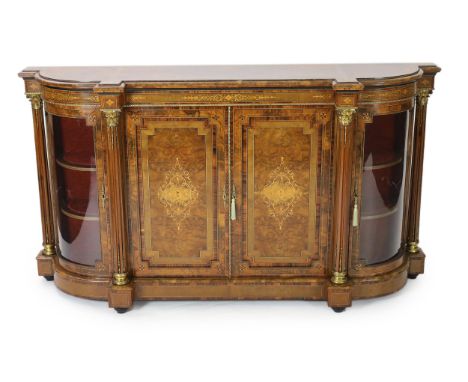 A Victorian marquetry inlaid figured walnut credenza of breakfront form with two panelled doors divided by corinthian columns
