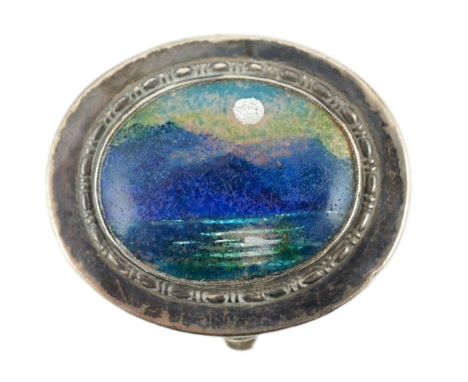 A George V Arts &amp; Crafts Liberty &amp; Co silver and enamel oval pill box, with hinged cover, Birmingham, 1929, the cover