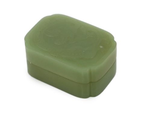 A Chinese green jade box and cover, possibly Ming dynasty, of rectangular form with re-entrant corners, the cover carved in l