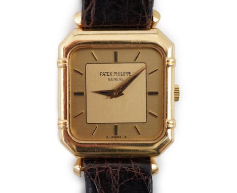 A lady's 18ct gold Patek Philippe manual wind square dial wrist watch, with octagonal case and baton numerals, inside case nu