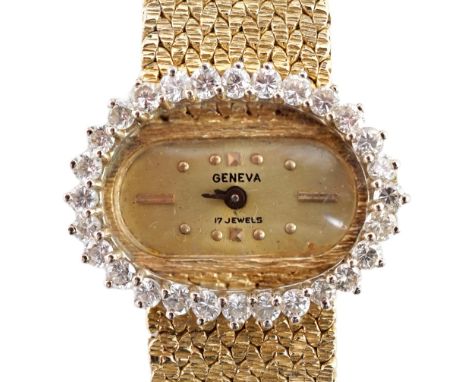 A lady's modern Swiss 14k gold and diamond set manual wind oval wrist watch, on integral 14k gold bracelet, case diameter 23m