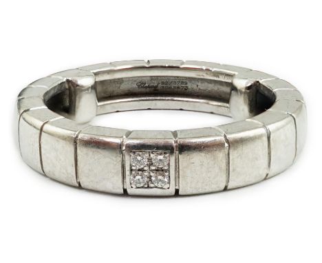 A modern Chopard 18ct white gold and four stone diamond chip cluster set band, signed and numbered 82/3789, size K/L, gross w