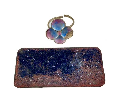 An Arts &amp; Crafts silver and enamel flower head ring by Alice Waymouth. The enamel on the ring is damaged; together with a