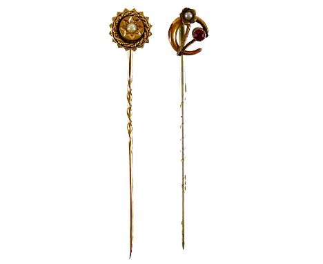 Two gold stick pins. One with a 9ct head set with a garnet and pearl, the other with gold head and pin, the head set with a s