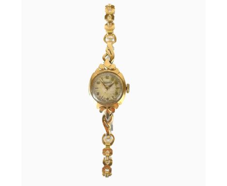 A 1950's 9ct gold Rotary ladies manual wind wristwatch. On a gold plated bracelet, watch back weight 1.5g.