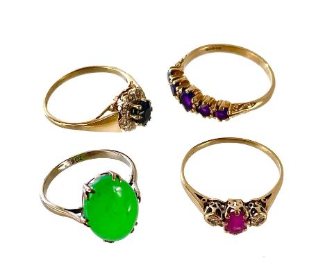 Four 9ct gold stone set rings. To include a diamond and ruby three stone ring, size P, a diamond and sapphire cluster, size N