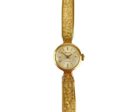 An Accurist 1960's 9ct gold ladies manual wind bracelet wristwatch.  With 14mm silvered dial, 17 jewel movement, London 1966,