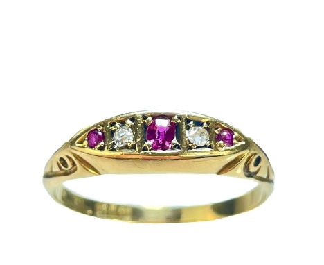 An Edwardian 18ct gold diamond and garnet five stone ring. The two diamonds each measure 0.03ct, stamped 18ct, size Q 1/2, 3g