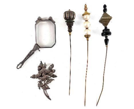 A silver and marcasite brooch, three hatpins and an Art Deco silver lorgnette. (5)