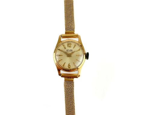 An 18ct gold ladies manual wind bracelet wristwatch. The silver 17mm dial signed NIVOR and with gilt baton and with 6 and 12 