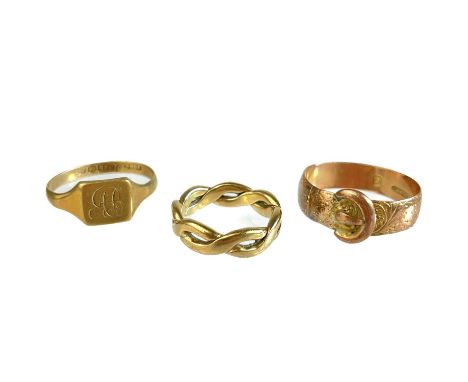 Three 9ct hallmarked gold rings. One a buckle ring in rose gold, Birmingham 1915, size M, a childs signet ring and an open tw