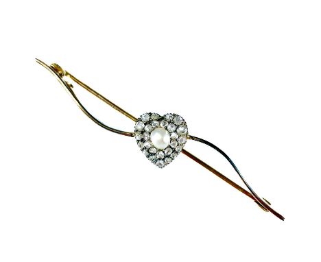 An Edwardian gold diamond and half pearl set heart shaped bar brooch. The applied heart with a centred pearl surrounded by 26