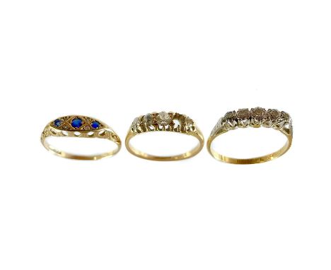 Two 18ct gold diamond five stone rings. One with a missing stone, the largest diamond 0.10ct, size N, the other ring with pla