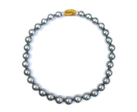 A grey cultured pearl necklace with 18ct bi-colour gold yellow and white diamond clasp. The 31 graduated pearls on a single s