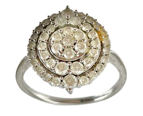 A contemporary 9ct hallmarked white gold diamond set cluster target ring. The two largest diamonds 0.04ct, size O, 3g.