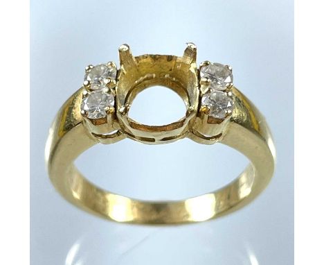An 18ct ring set with four round diamonds, the main stone missing. The diamonds each 0.07ct, size L 1/2, 6g.