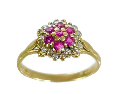A 9ct diamond and ruby cluster ring. Size Q, 2.2g.