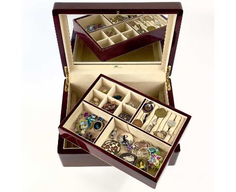 A jewellery box with a small selection of costume jewellery. Including two Scandinavian silver and enamel brooches. The box i