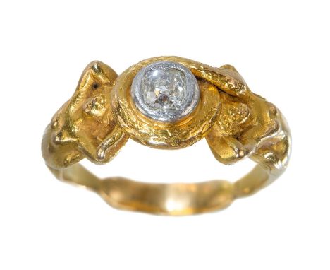 A good 19th century 18ct gold and diamond set mermaid and serpent cast ring. The old mine cut diamond measuring 0.30ct approx