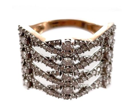 A contemporary 9ct rose gold diamond open cross over design diamond set ring. The three rows of largest diamonds each 0.03ct,