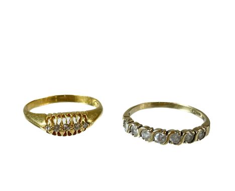 An Edwardian 18ct gold and diamond set five stone ring. Each diamond 0.02ct, size P, 3g; together with a 9ct white stone set 
