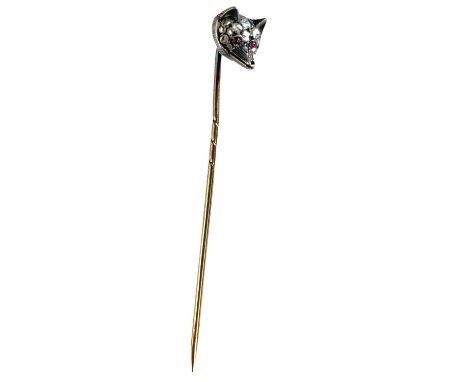 A Victorian 15ct gold diamond and ruby set fox head tie pin. The head set with 17 small diamonds in white gold, the eyes set 