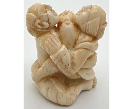 A carved Chinese erotic netsuke with signature mark to underside. Approx. 4.5cm tall. 