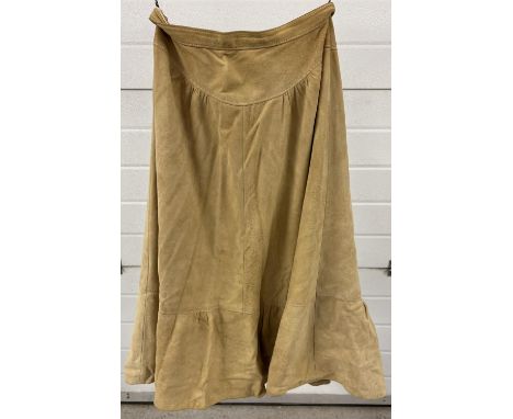 A vintage A-Line style light tan suede skirt by Wallace Sacks. With drop waist and frilled bottom. Waist size approx. 26 inch