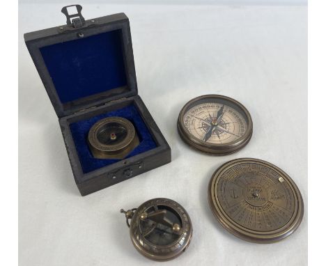 3 metal cased naval compasses. A large brass cased compass with screw top lid featuring a perpetual calendar (approx. 8cm dia