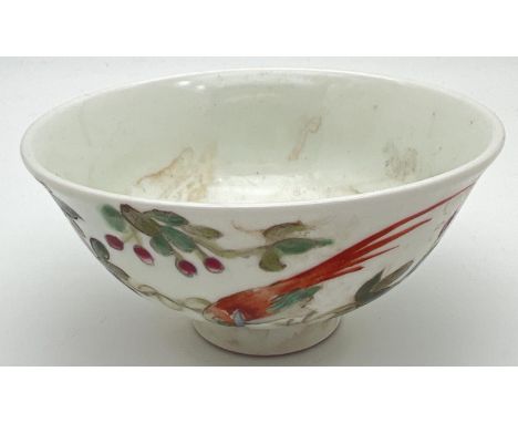 A small Chinese ceramic tea bowl with hand painted bird and blossom design to outer bowl. Signed to underside. Approx. 5cm ta