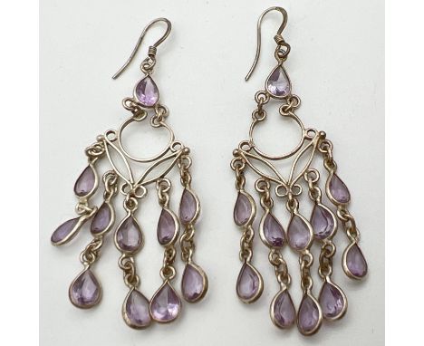 A pair of silver chandelier style drop earrings set with 11 teardrop cut amethyst stones. Posts marked 925, total length appr