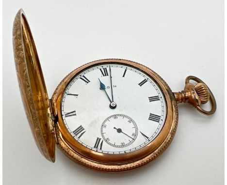 An antique Elgin National Watch Company USA, 7 jewel gold plated pocket watch with Keystone case. Floral engraving to front a