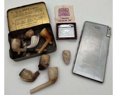 A small collection of vintage smoking related items. A Kincraft cigarette case with integral lighter, engine turned decoratio