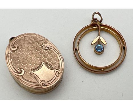 2 vintage gold plated pendants. An Art Deco circular shaped pendant with central flower detail set with a blue stone. Togethe