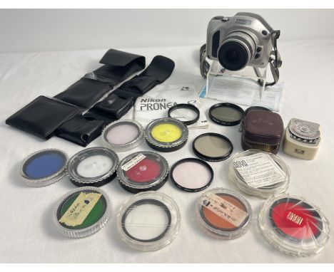 A Nikon Pronea S digital camera with instruction booklet. Together with a collection of filters to include coloured and a vin