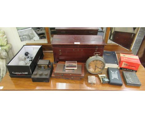 A mixed lot: to include a late 19thC telegraph tape punch; and four vintage Osram light bulbs; and a clockwork alarm clock 