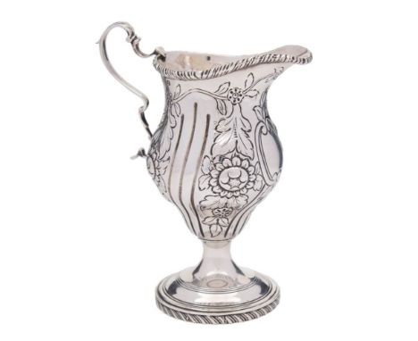 A George V silver cream jug, maker George Nathan &amp; Ridley Hayes, Chester, 1911: of baluster outline with gadrooned border