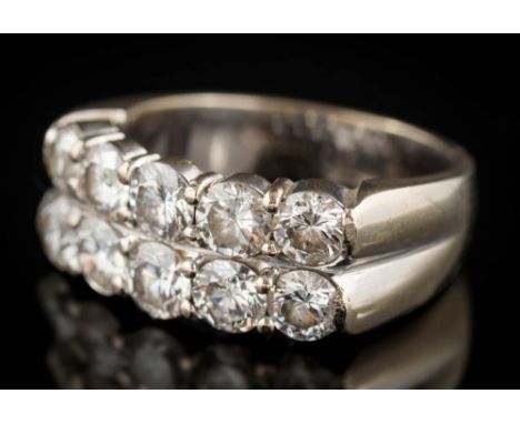 A diamond ten-stone, two-row cluster ring: the round brilliant-cut diamonds estimated to weigh a total of 2.3cts, the shank s