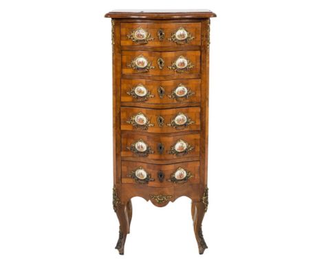 A French walnut veneered, crossbanded and gilt metal and porcelain mounted serpentine fronted upright chest:, of small size, 