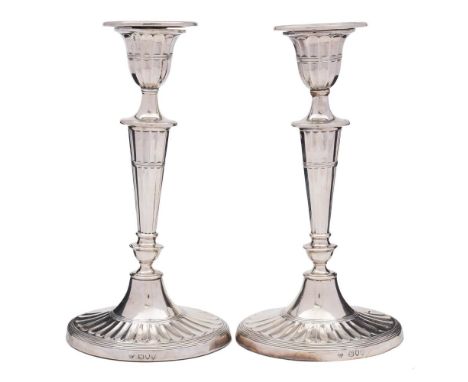 A pair of Victorian silver candlesticks, maker William Hutton &amp; Sons Ltd, London, 1894: of oval design, with urn-shaped n