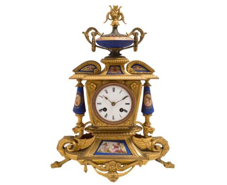 A gilt-metal and porcelain mantel clock: the eight-day duration movement striking the hours and half-hours on a bell, the rou