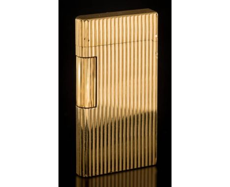 Caran d'Ache. A gold plated lighter: of ribbed design. 