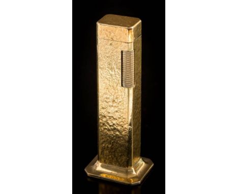 A Dunhill 'Tallboy' table lighter: of hammered finish, approximately 11cm overall height. 