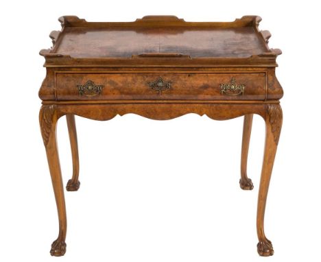 A Dutch burr walnut rectangular silver table:, in the early 18th Century taste, having a shaped moulded scroll tray top, the 