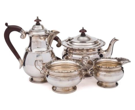 A George V silver four-piece tea service, maker Ollivant & Botsford, Birmingham, 1935: of plain circular form with wavy edge 